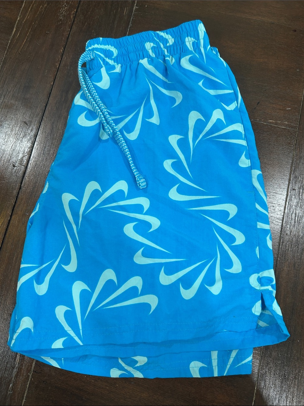 Nike Men’s S Bright Blue Swim Shorts with White Nike Swirl Print